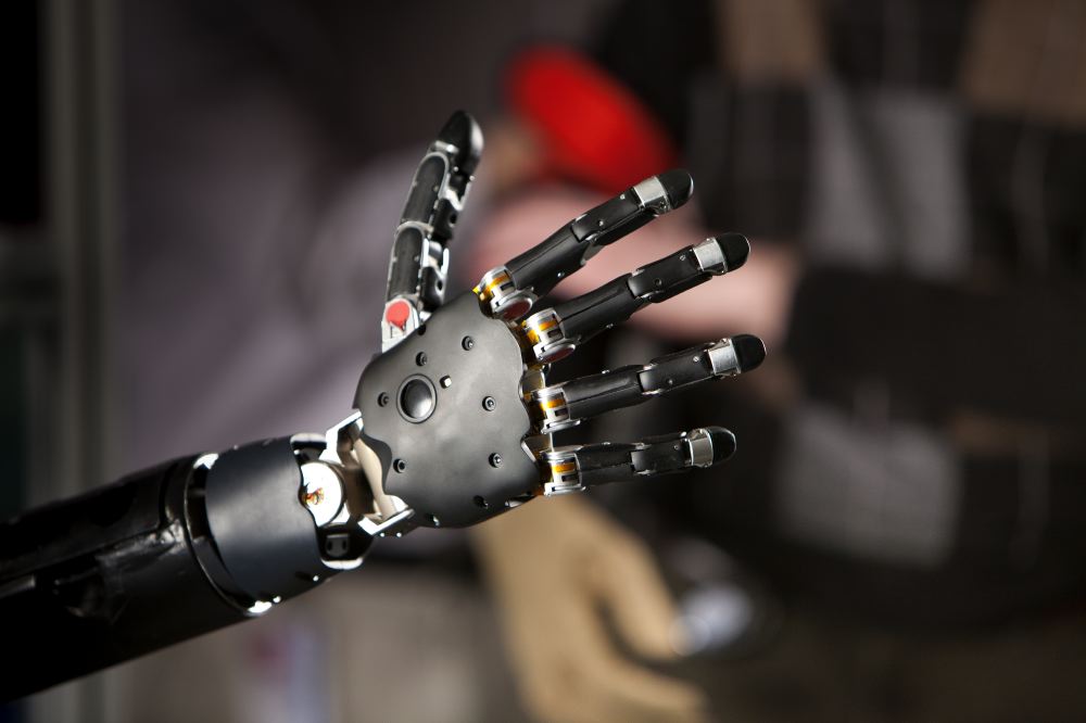 A close-up of an advanced robotic prosthetic hand with articulated fingers