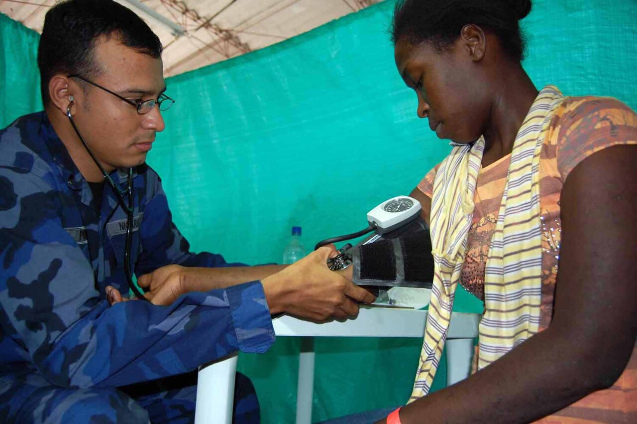 A doctor checking a patient's blood pressure during a routine checkup