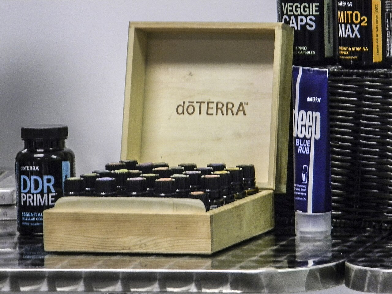 A wooden starter kit box of essential oil products from a multi-level marketing company