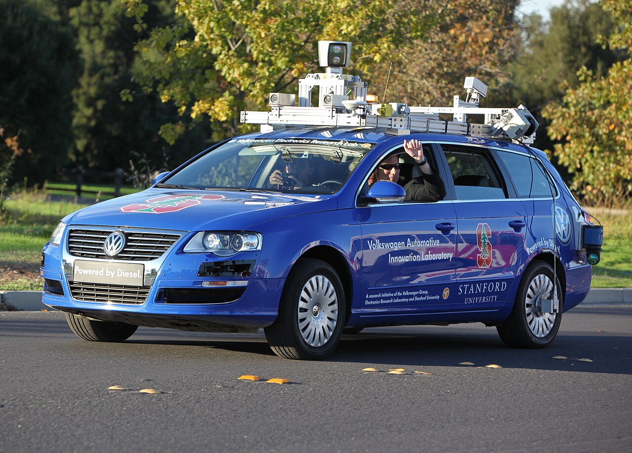 An experimental self-driving research car equipped with sensors and cameras on the roof