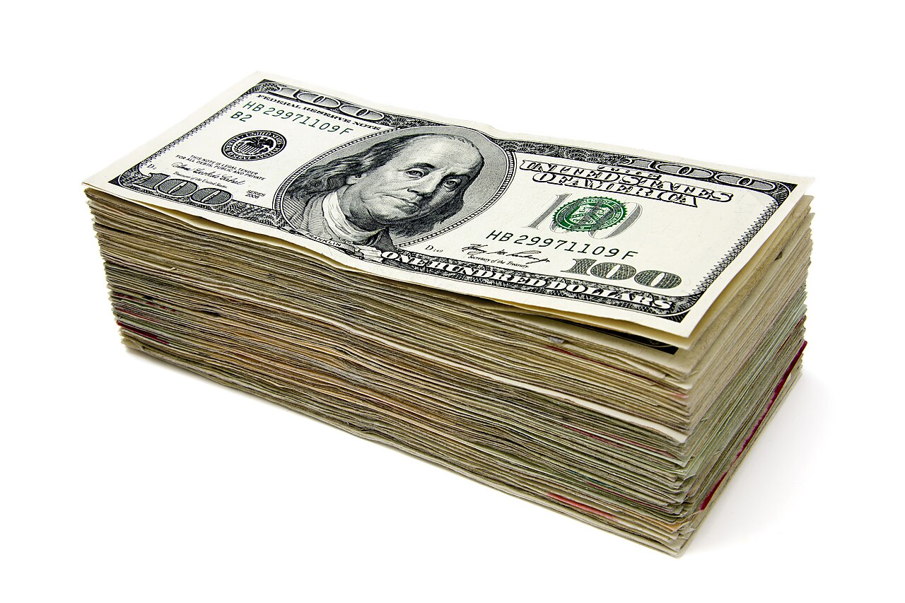 A thick stack of one hundred dollar bills